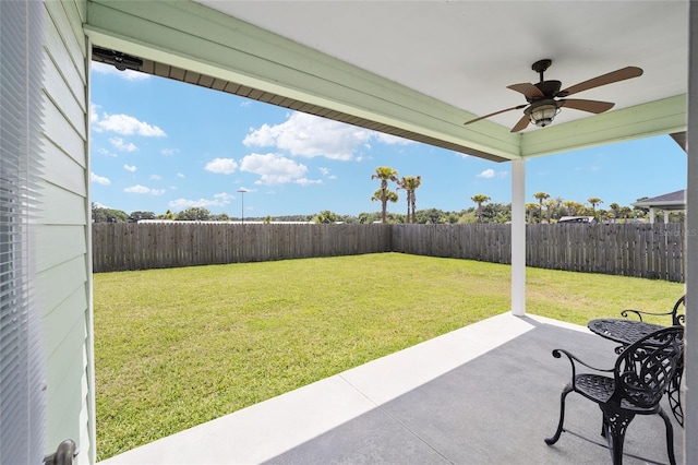 view of yard featuring ceiling fan and a patio area