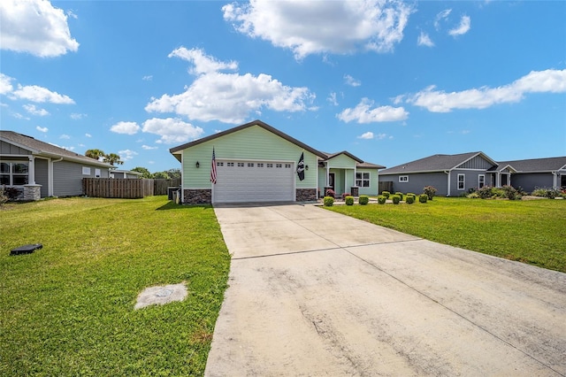 ranch-style home featuring a front lawn and a garage