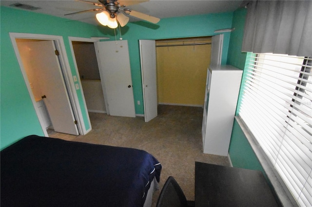 carpeted bedroom with a closet and ceiling fan