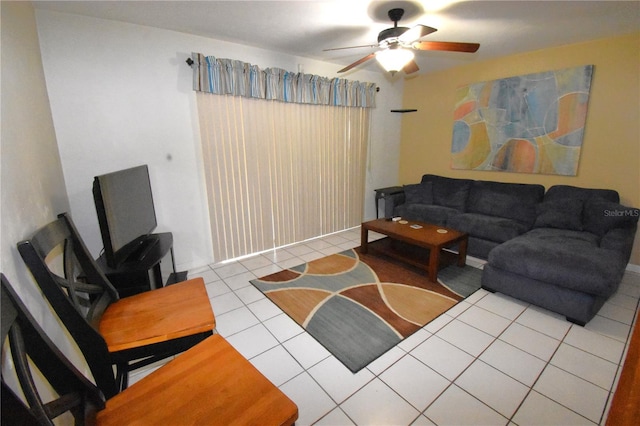 living room featuring ceiling fan and light tile floors