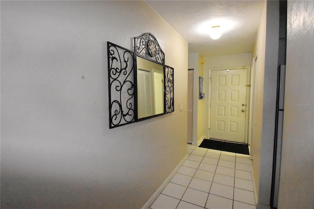 hall featuring light tile floors