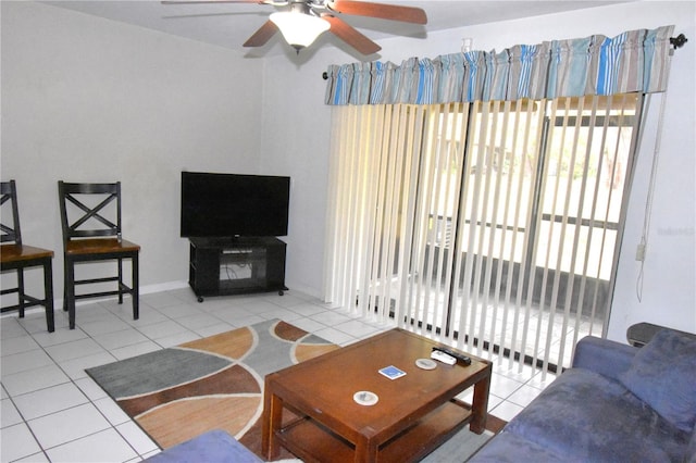 tiled living room featuring ceiling fan