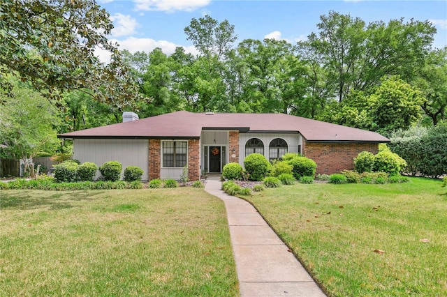 single story home with a front lawn