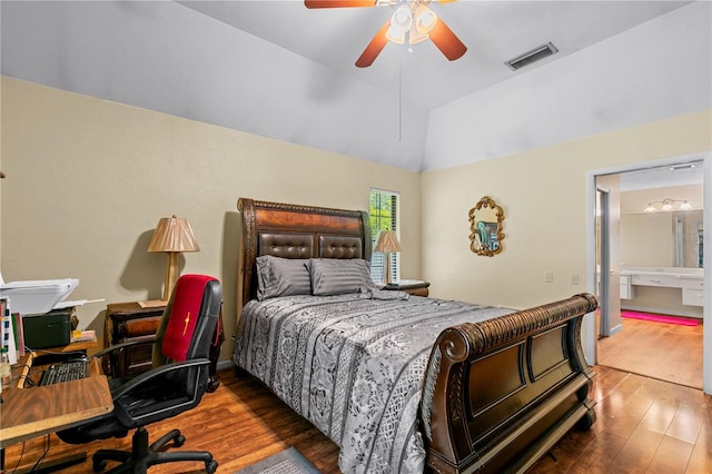 bedroom featuring ceiling fan, lofted ceiling, dark hardwood / wood-style floors, and ensuite bathroom