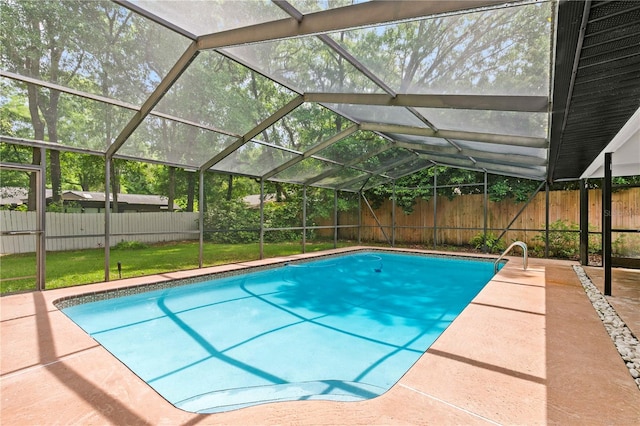 view of pool featuring glass enclosure and a patio