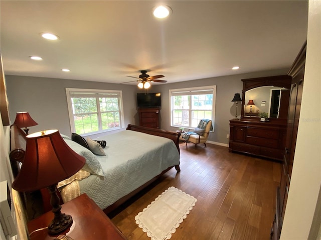 bedroom featuring ceiling fan and dark hardwood / wood-style floors