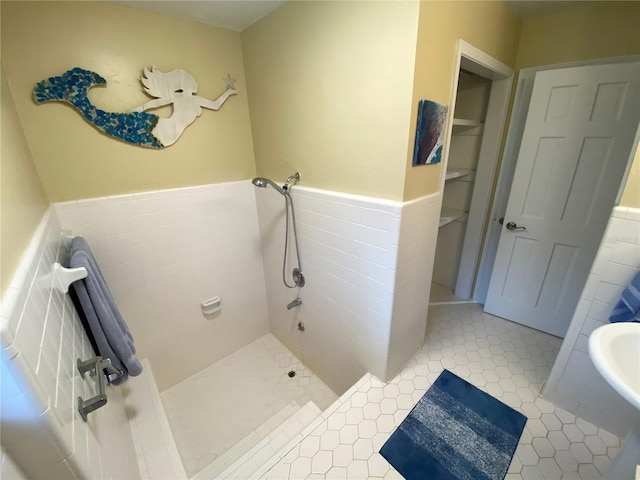 bathroom with tile patterned flooring and a shower