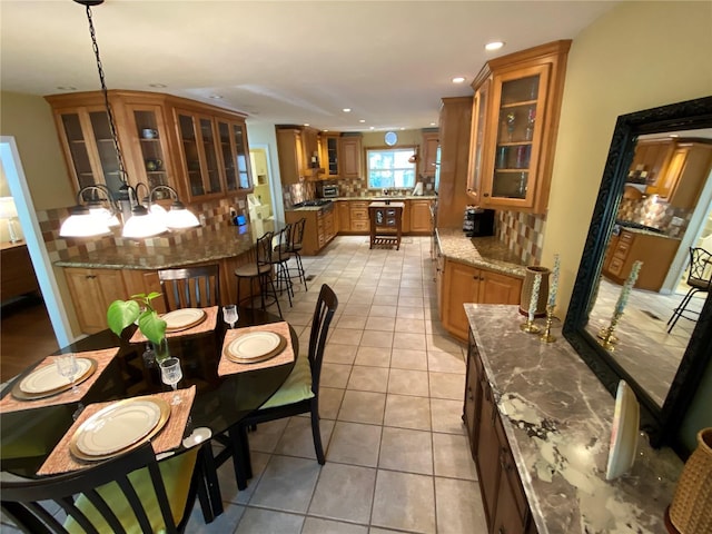 dining area with light tile patterned floors