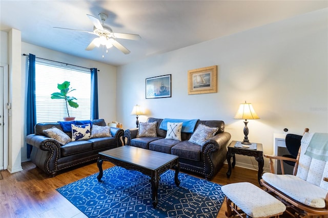 living room featuring dark hardwood / wood-style flooring and ceiling fan