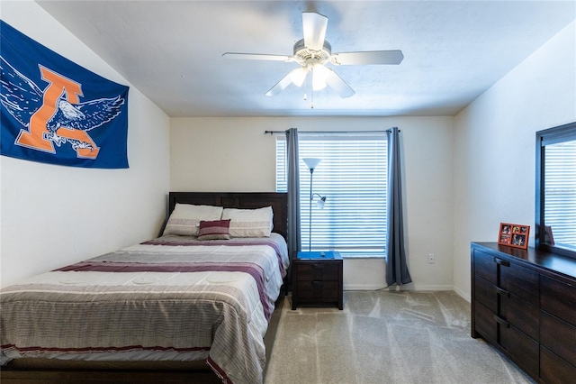 bedroom with light colored carpet and ceiling fan