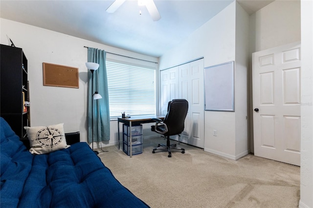 carpeted office space featuring ceiling fan