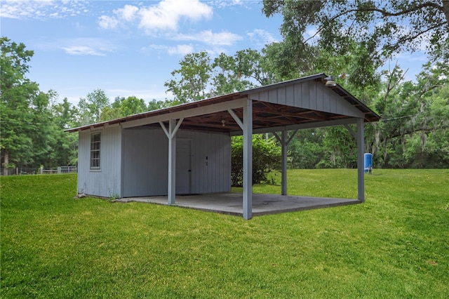 view of outdoor structure with an outbuilding and a carport