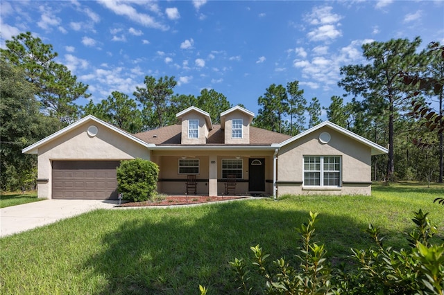 view of front of property featuring a front yard and a garage