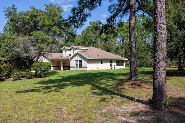 view of front of property with a front lawn