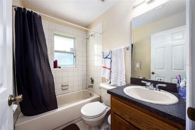 full bathroom featuring shower / bathtub combination with curtain, toilet, and vanity