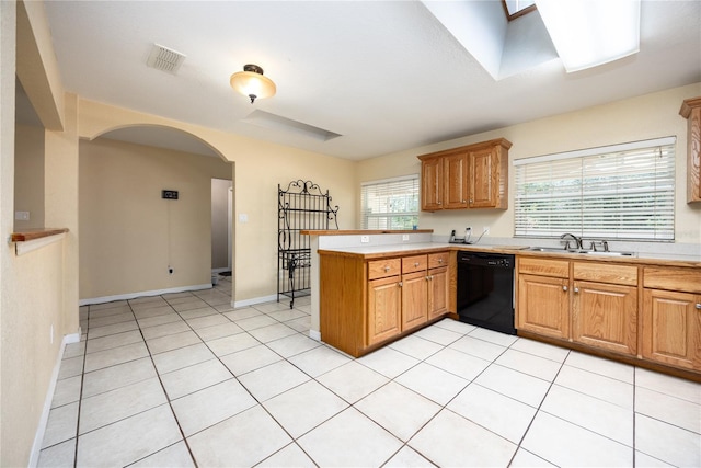 kitchen with black dishwasher, light tile patterned flooring, sink, and kitchen peninsula