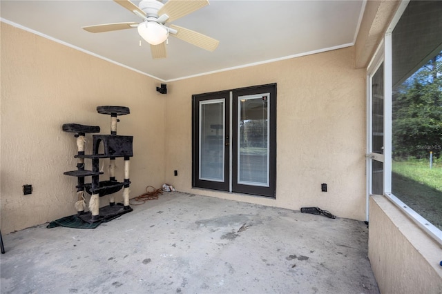 exterior space with ceiling fan and crown molding