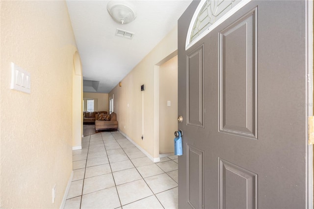 corridor featuring light tile patterned flooring