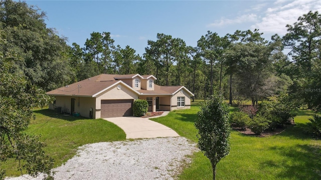 view of front of home with a garage and a front yard