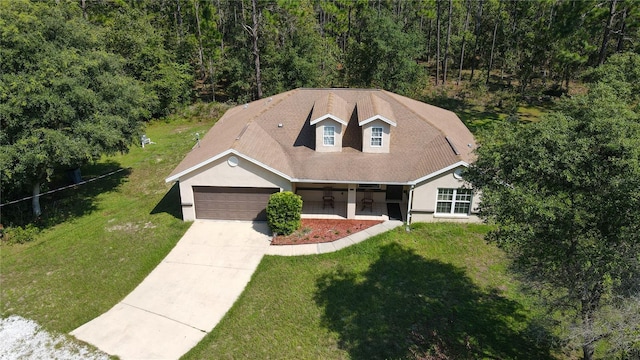 view of front facade featuring a front yard and a garage