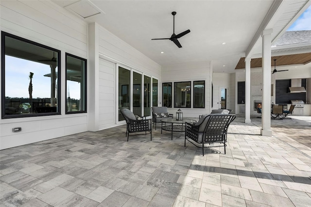 view of patio / terrace with ceiling fan and outdoor lounge area