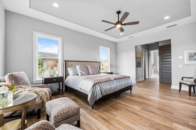 bedroom featuring light hardwood / wood-style floors and ceiling fan