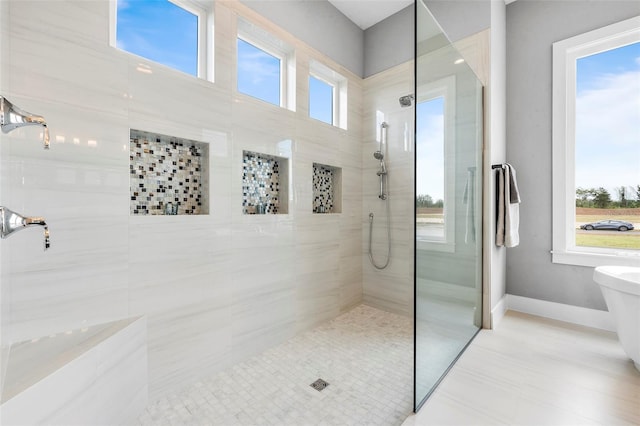 bathroom with tile floors and an enclosed shower