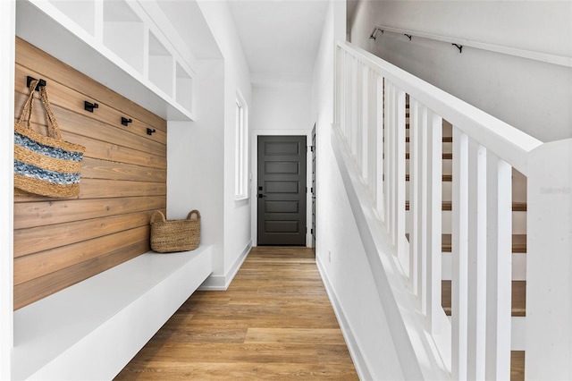 mudroom with light hardwood / wood-style floors