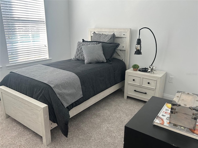 bedroom with light colored carpet