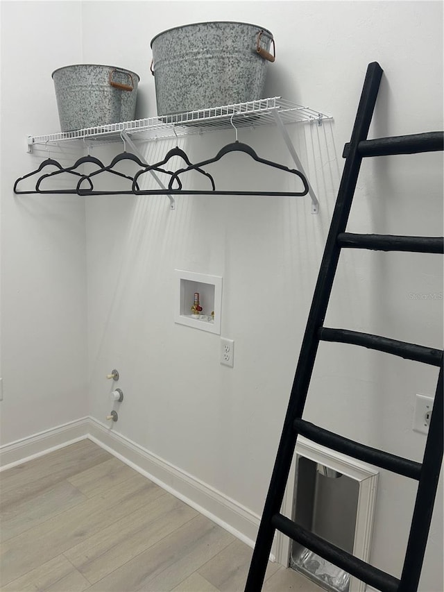 laundry room featuring hookup for a washing machine, hookup for a gas dryer, and wood-type flooring