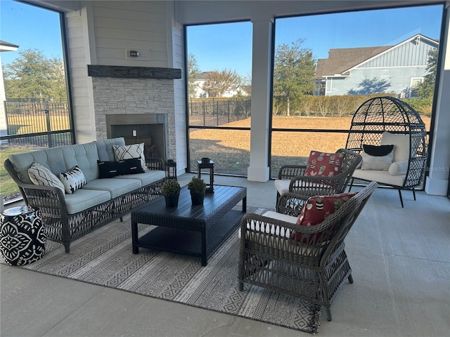 interior space with a healthy amount of sunlight and an outdoor stone fireplace