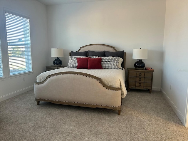 bedroom with light colored carpet