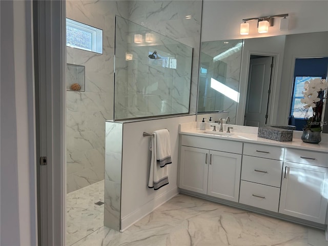 bathroom featuring vanity and tiled shower