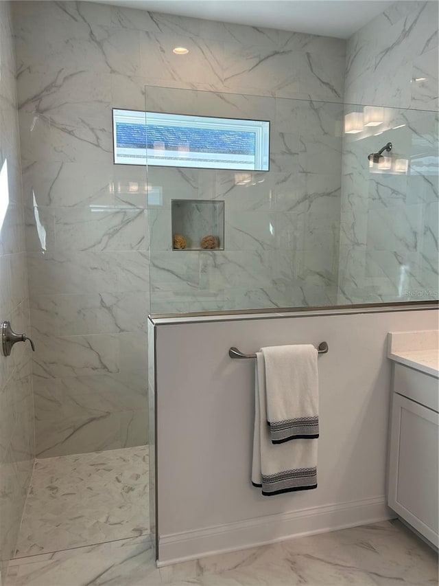 bathroom featuring vanity and a tile shower