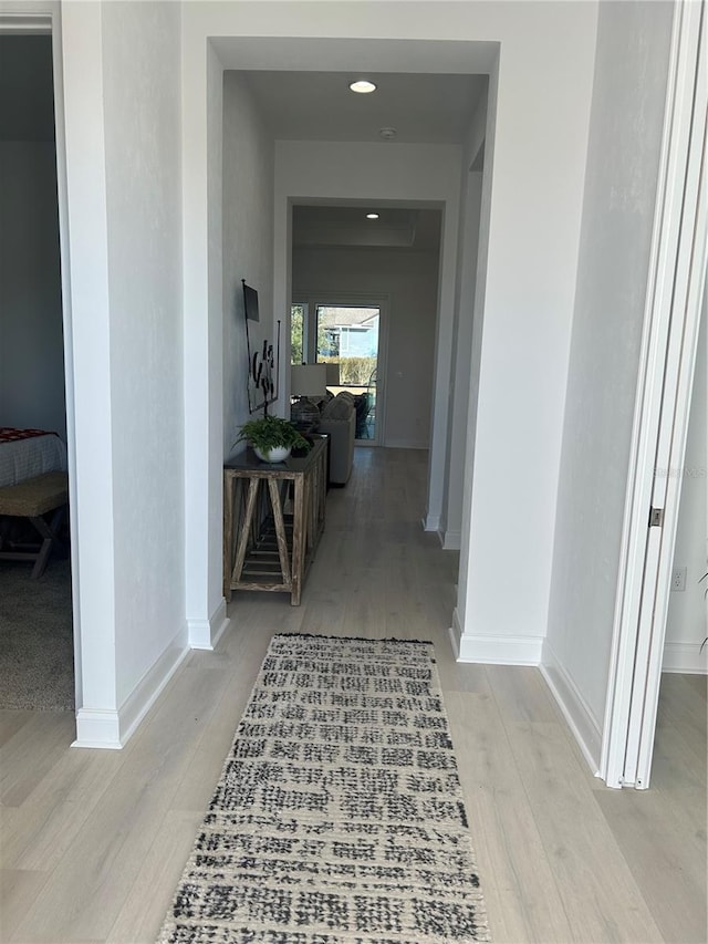 hallway featuring light hardwood / wood-style flooring