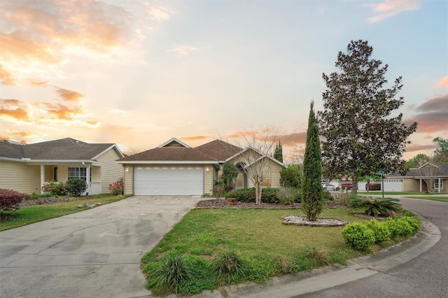 single story home with a lawn and a garage