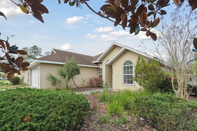 ranch-style house featuring a garage