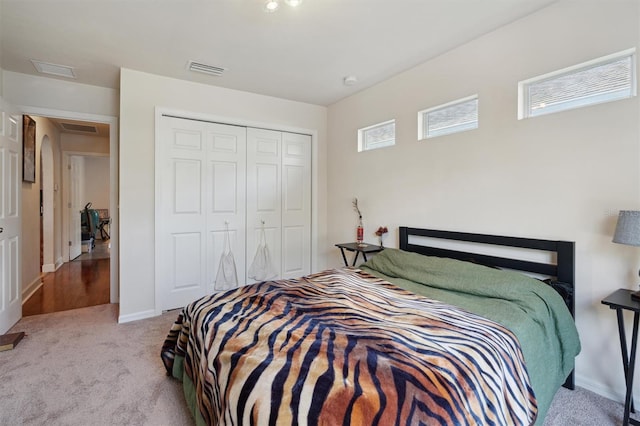 carpeted bedroom featuring a closet