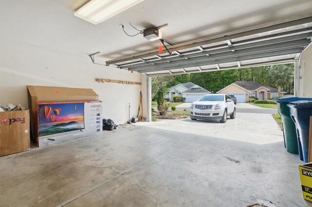 garage featuring a carport and a garage door opener