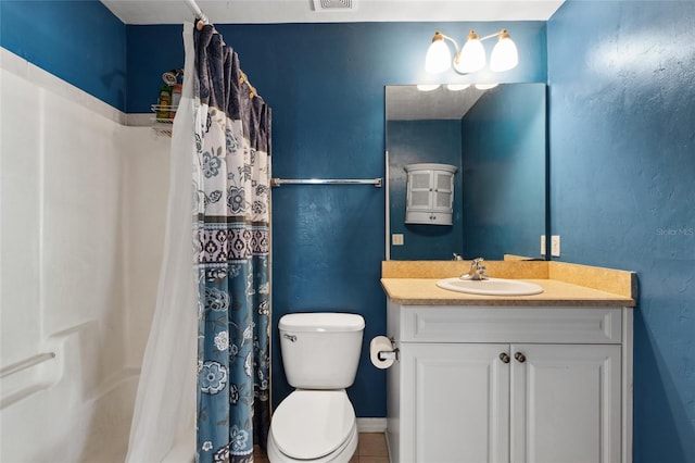 bathroom featuring tile patterned floors, a shower with curtain, vanity, and toilet