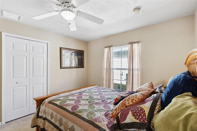 bedroom featuring light carpet, a closet, and ceiling fan