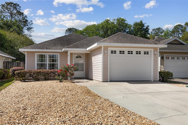 ranch-style home featuring a garage