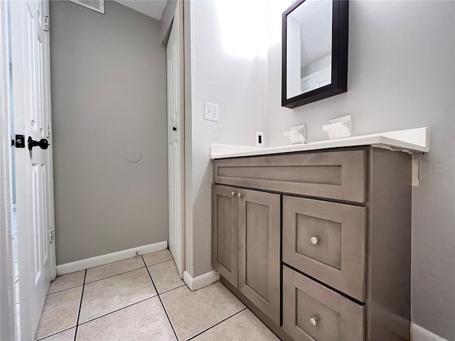 bathroom featuring tile flooring and vanity