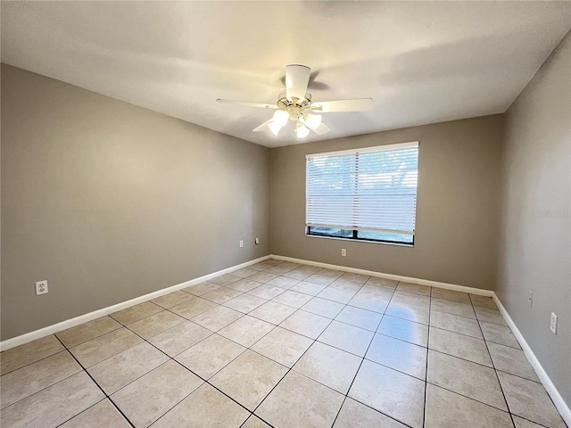 unfurnished room featuring ceiling fan and light tile floors