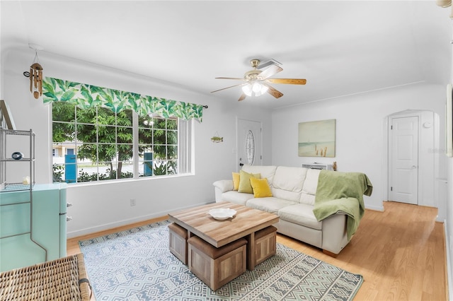 living room with ceiling fan and light wood-type flooring