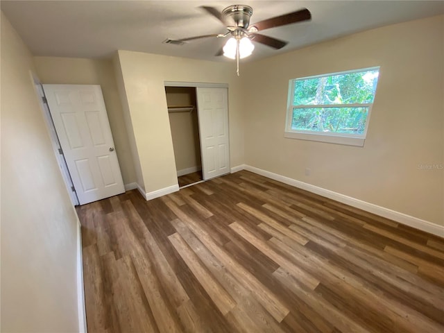 unfurnished bedroom with ceiling fan, hardwood / wood-style floors, and a closet