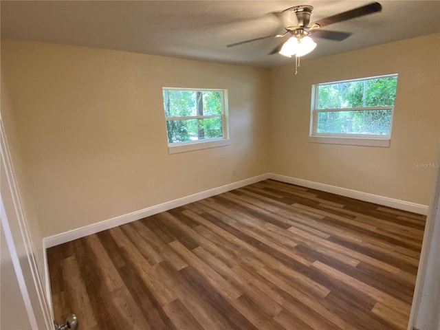 spare room with hardwood / wood-style flooring and ceiling fan