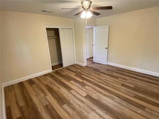 unfurnished bedroom with hardwood / wood-style flooring, a closet, and ceiling fan