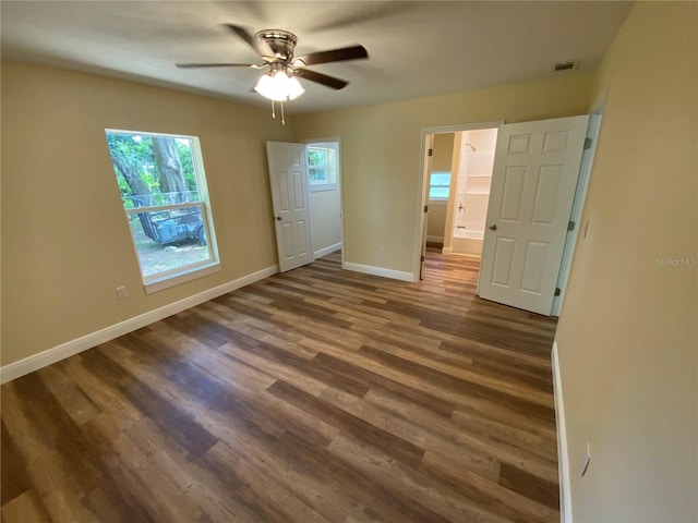 empty room with hardwood / wood-style flooring and ceiling fan