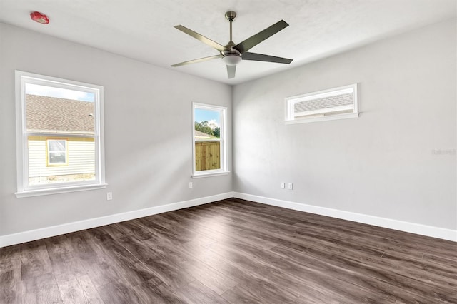 unfurnished room with dark hardwood / wood-style flooring, ceiling fan, and an AC wall unit